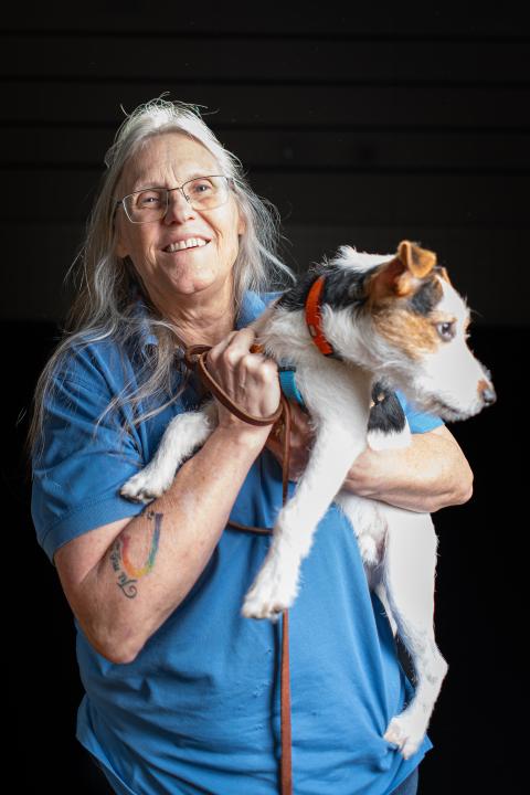 Denise, dog trainer at Animal Humane Society, poses with her dog