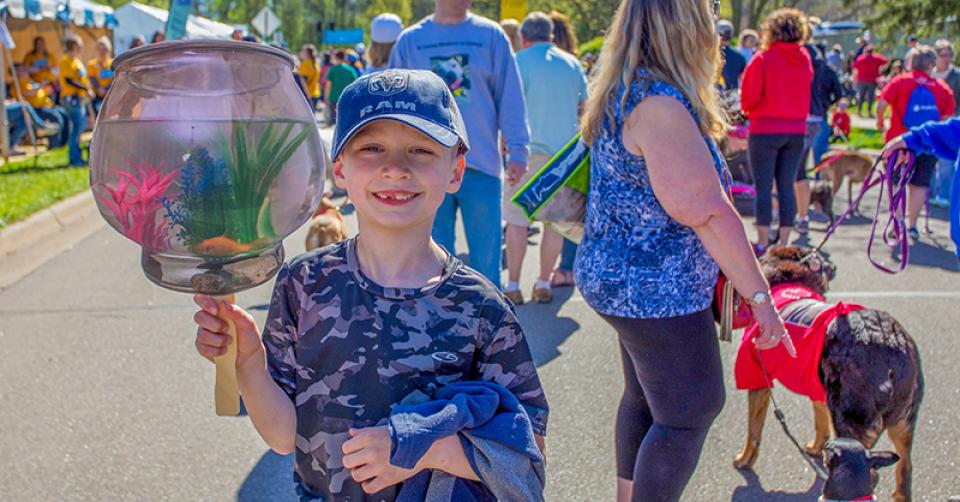 Smiling child at Walk for Animals
